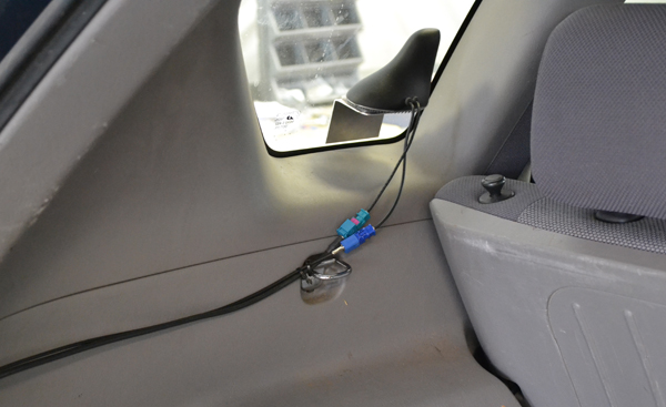 A GPS device is installed in the rear of a vehicle.