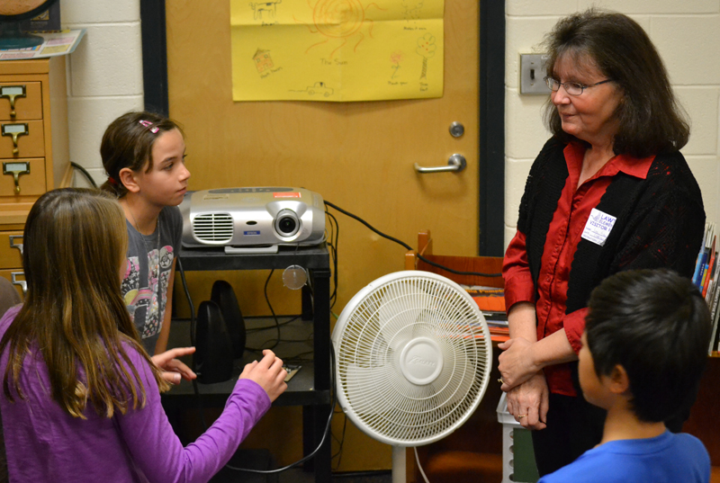 Local author Lori Sawicki takes questions about writing stories from Jan Starr's fourth graders. 