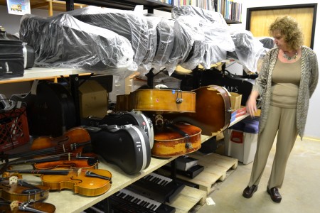 In the "instrument graveyard," Robin Bailey looks over the instruments used for spare parts.