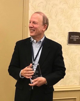 AAPS Deputy Superintendent Human Resources/Legal Counsel Dave Comsa holds the MASPA Michigan Human Resource Professional of the Year Award