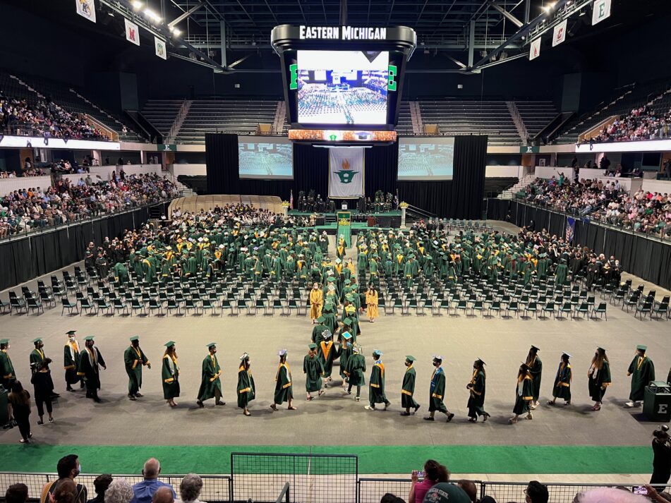 The Huron Class of 2022 walking not the arena floor