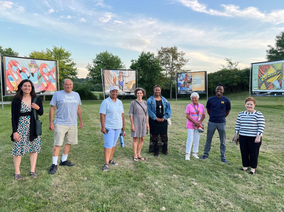 Members of the AAPS Board of Education, Superintendent Swift, Strategic Partnerships and Volunteer Coordinator Nancy Shore and Embracing Our Differences SE Michigan Executive Director Nancy Margolis at the art exhibit in Gallup Park