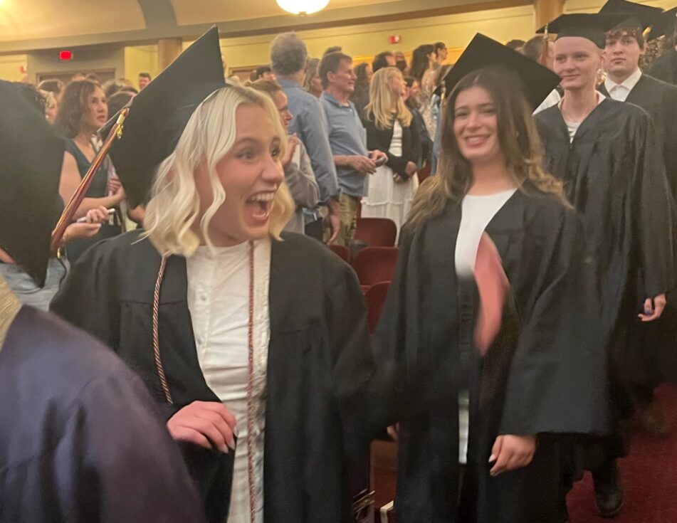 Community High graduates enter Hill Auditorium at the beginning of the ceremony.