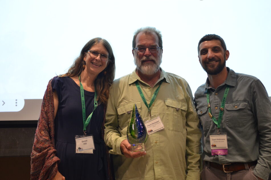 Dave Szczygiel with the William Stapp Environmental Education Award with Coert Ambrosino, current AAPS Environmental Education Lead Teacher and Sarah Hill, AAPS Environmental Education teacher.