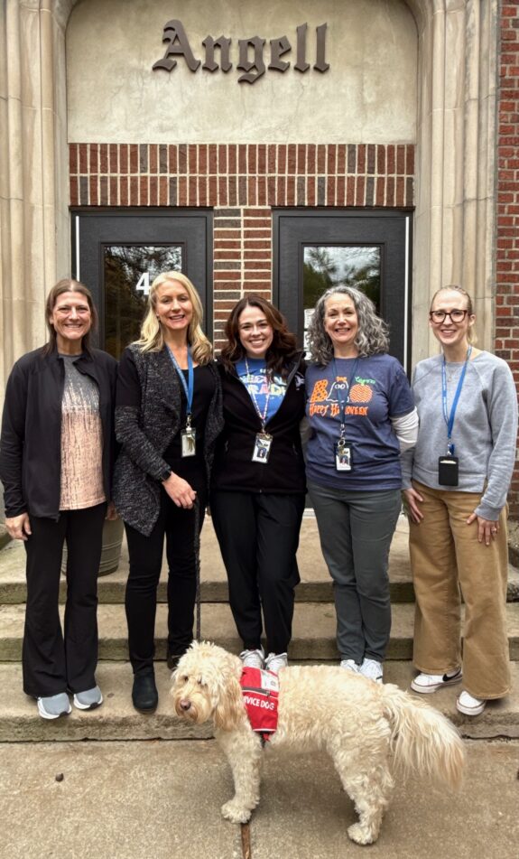 Angell's building support team in front of the school.