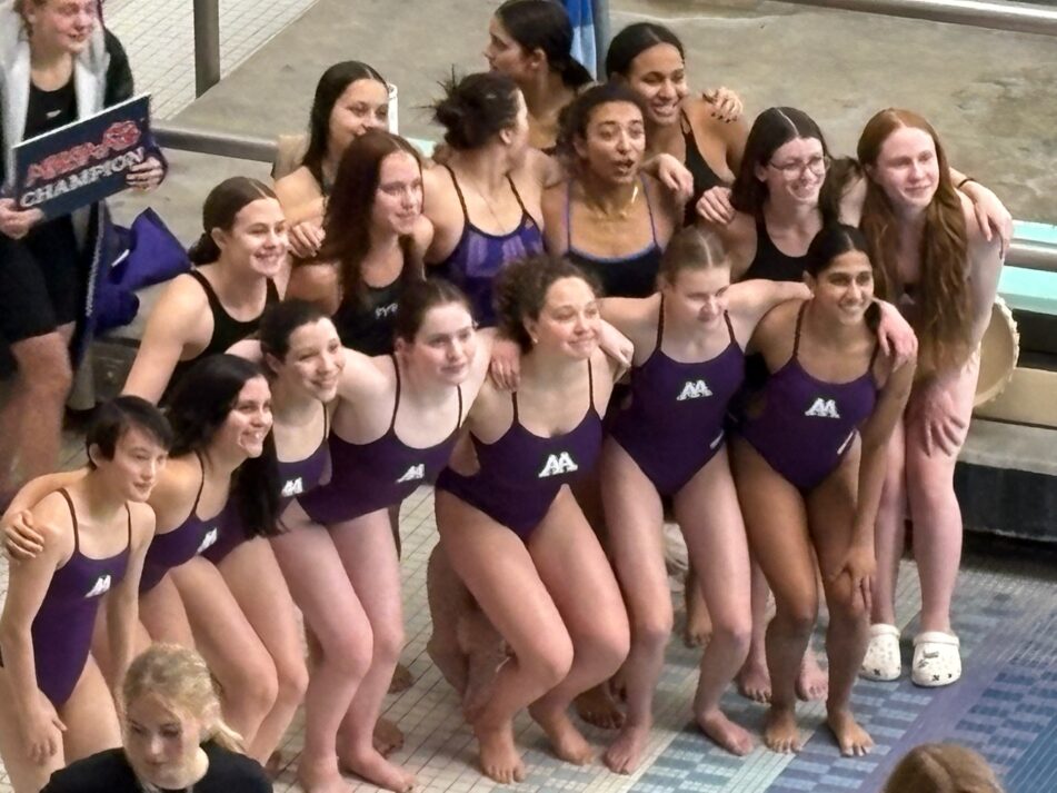 Pioneer girls swim and dive team after winning their sixth straight MHSAA Division One State Championship at Oakland University.