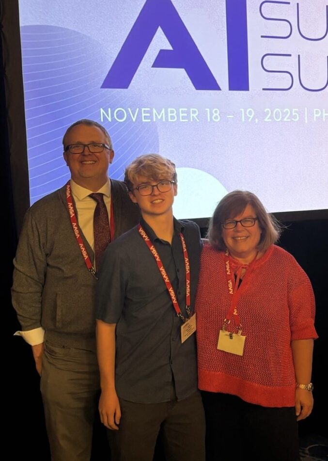 Huron senior Isaac Thomas, Executive Director, Instructional & Information Tech Heather Kellstrom and Scarlett Science teacher and AAPS Instructional Technology Consultant Chris Thomas at the AASA AI Super Summit in Phoenix in November