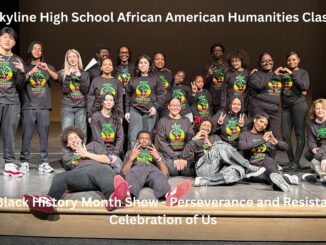 Skyline's African American Humanities Class on stage in matching shirts for their Black History Month Show