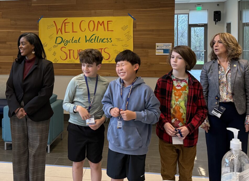 Superintendent Jazz Parks and University of Michigan Marsal Family School of Education Dean Elizabeth Moje join Clague sixth graders at Digital Wellness Expo