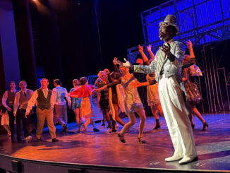Christian Weems (Billy Flynn) performs “Razzle Dazzle” with the ensemble of Pioneer Theatre Guild’s production of Chicago: Teen Edition. (Photo credit: Quinn Strassel)