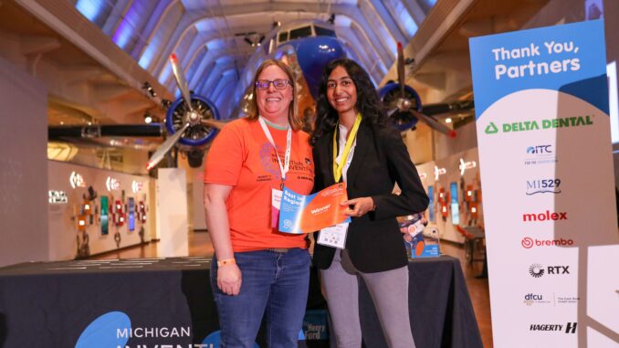 Huron's Kashvi Rai holding her Best in Region certificate and AAPS teacher Sarah Schemanske at the Henry Ford Museum.
