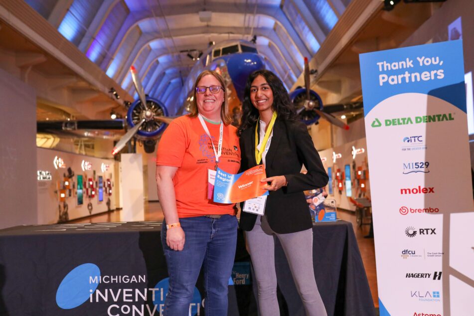 Huron's Kashvi Rai holding her Best in Region certificate and AAPS teacher Sarah Schemanske at the Henry Ford Museum.