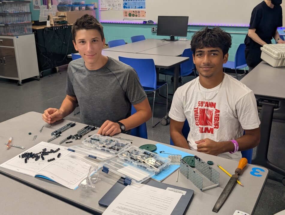 A pair of Pioneer students in a PLTW classroom.