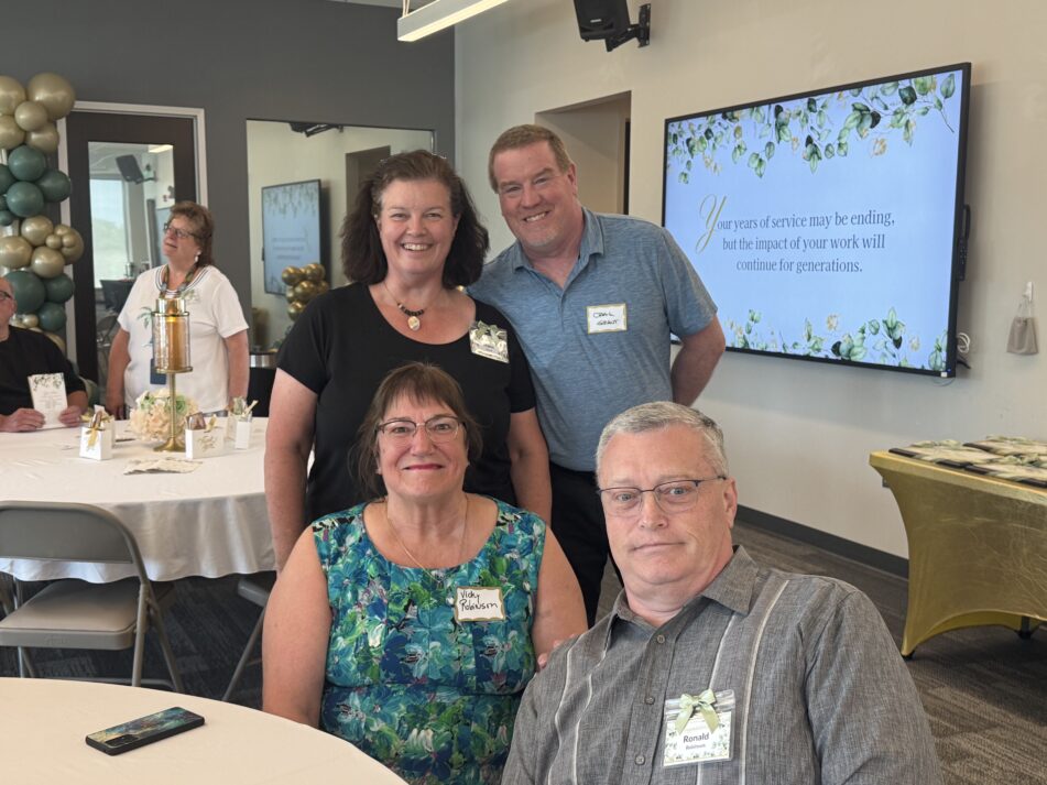 Two AAPS retirees and their guests at the reception.