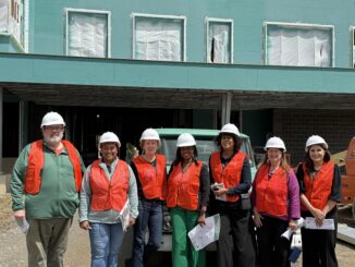 Members of the Board of Education and Superintendent Jazz Parks in front of the new Mitchell Elementary still under construction