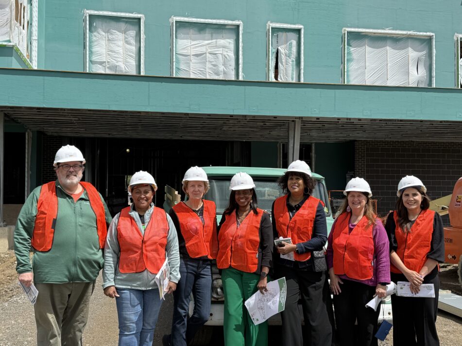 Members of the Board of Education and Superintendent Jazz Parks in front of the new Mitchell Elementary still under construction