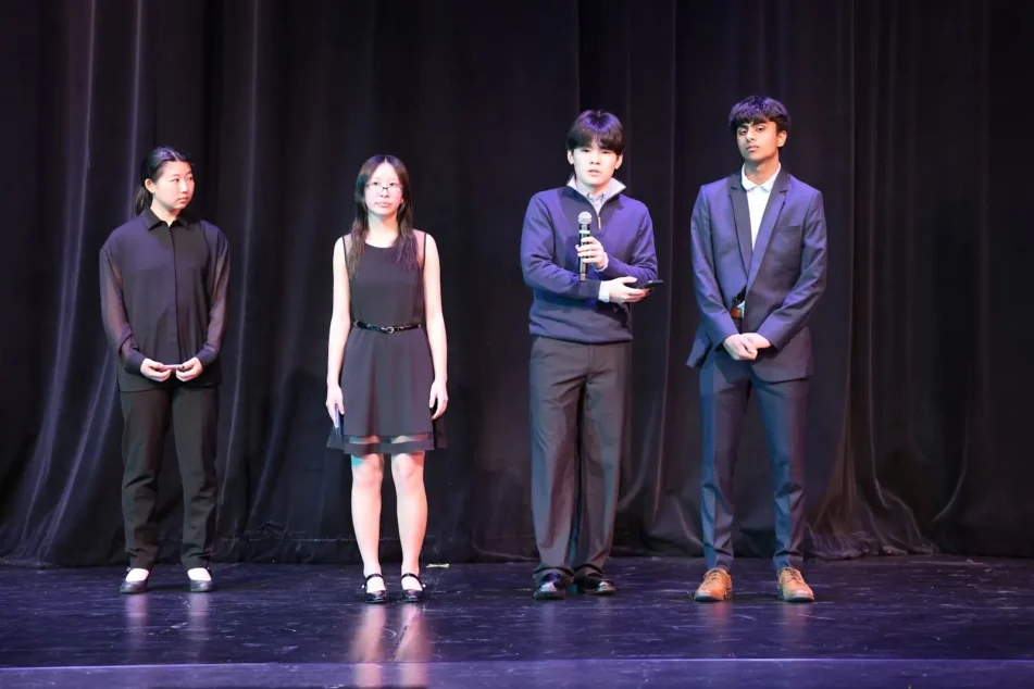 Members of the AG Camp Bard speaking at the Ann Arbor Dance Classics Benefit Show. Left to right: Izzy Choi, Sophia Zheng, Caleb Lee, and Tarun Iyer.