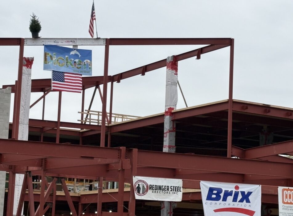 The last beam in place at the new Dicken, with the traditional evergreen for luck on top of the beam.