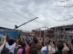 Dicken students and staff cheer as the last beam is placed in their new school
