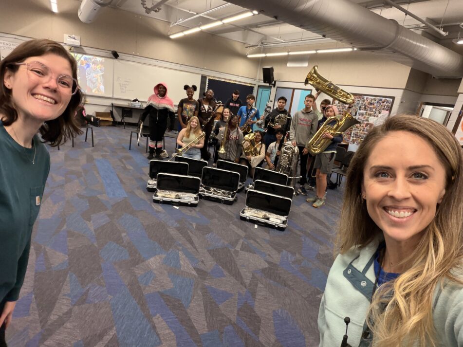 Band Co-Directors Amanda and Caroline Fitzgerald, with band members and new instruments